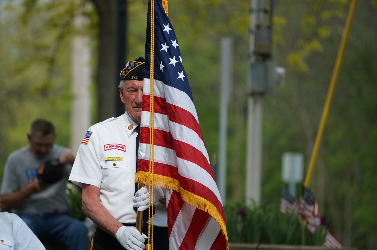A vet holding the flag during a Sedona memorial day celebration