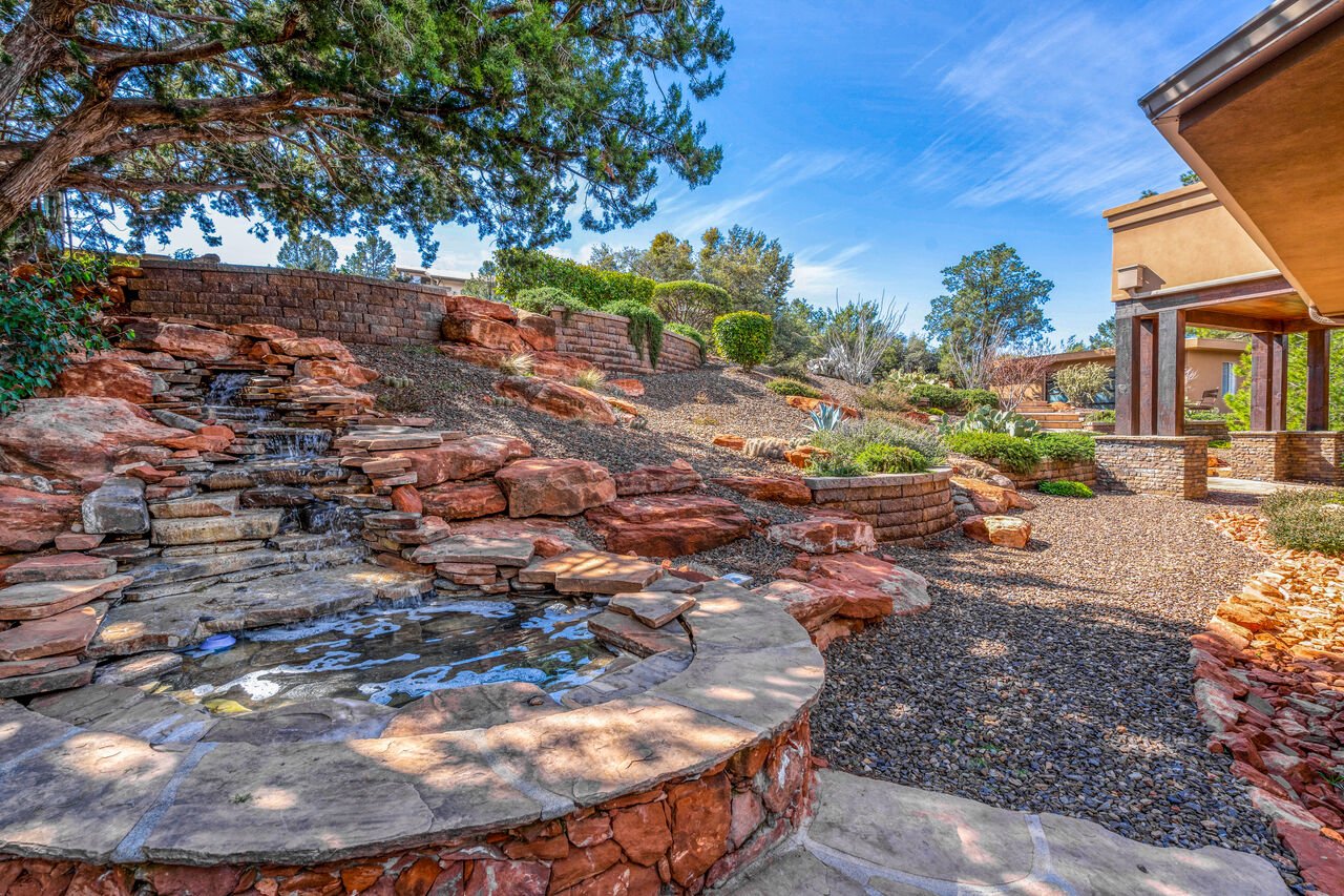 The backyard landscaping and fountain of one of our Sedona Vacation Villas