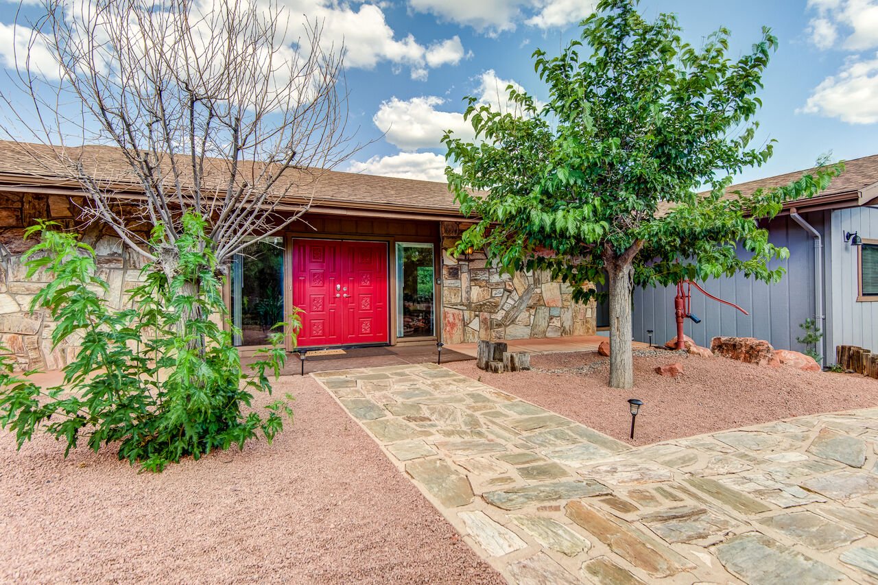 The front entryway and red door of a Rental Property in Sedona AZ