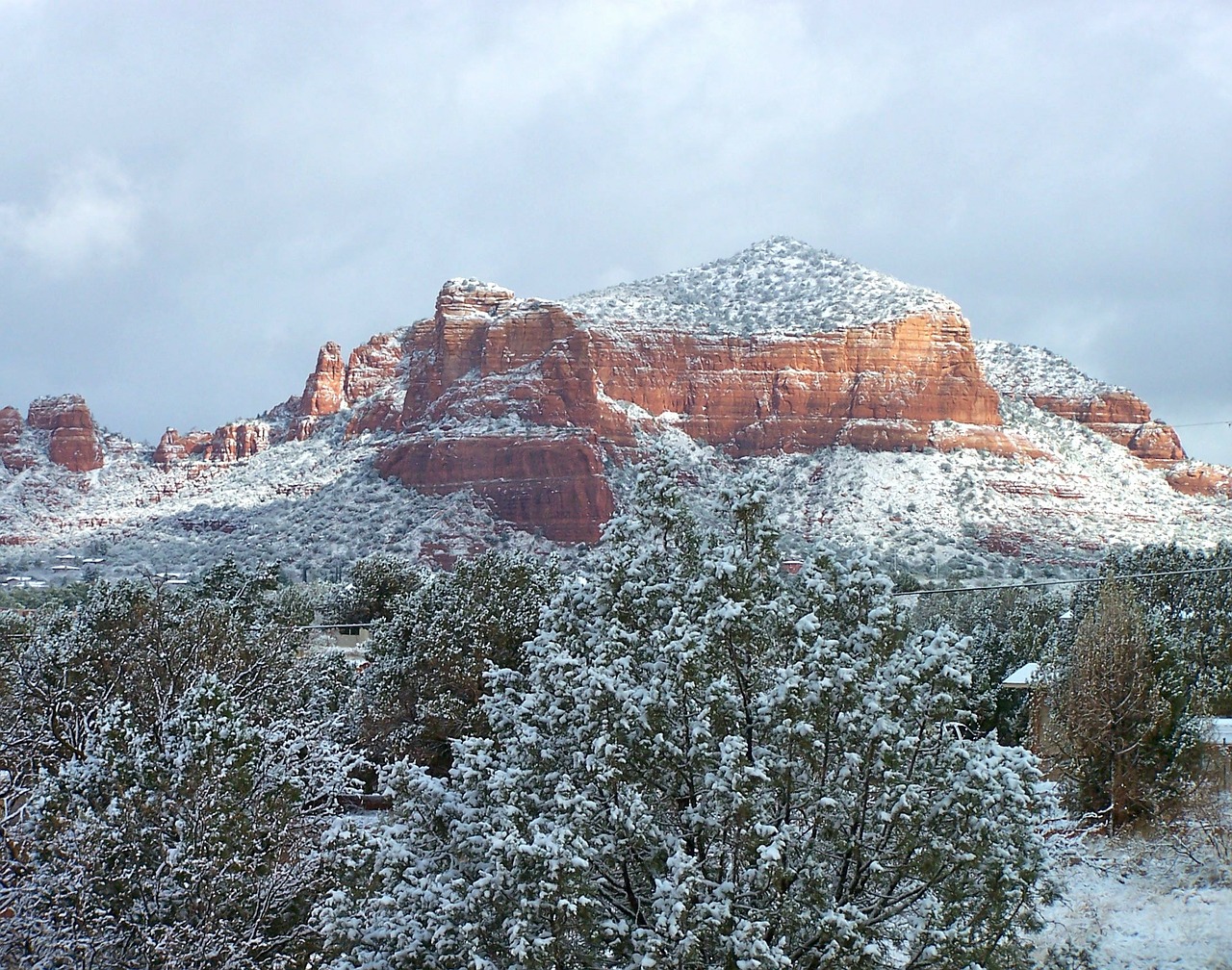 Red rock mountains covered in snow