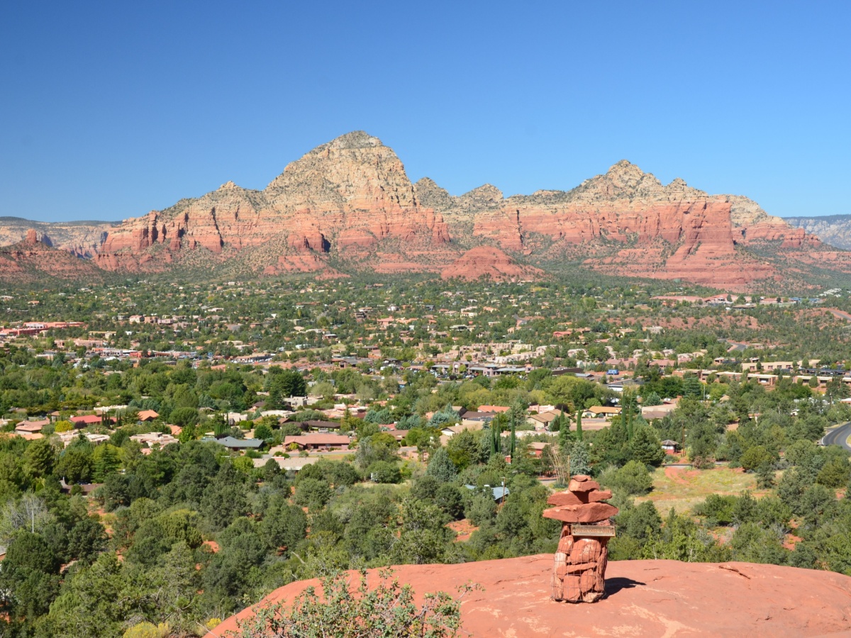View from Airport Mesa Vortex Trail overlook with a bright blue sky and a view of Sedona.