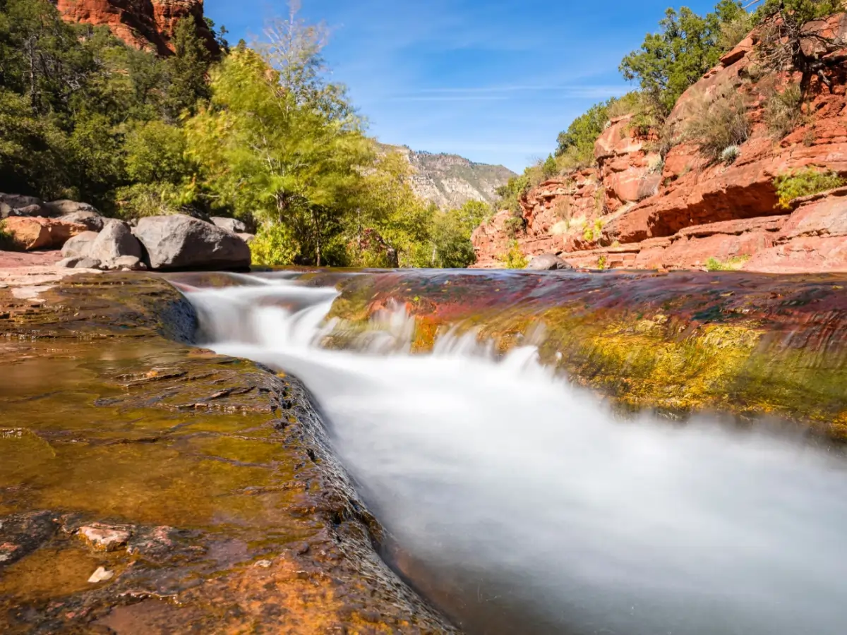 Waterfall over slippery slide rocks in Oak Creek Canyon Sedona.